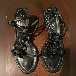 Classic Coach kitten heels with floral embellishments